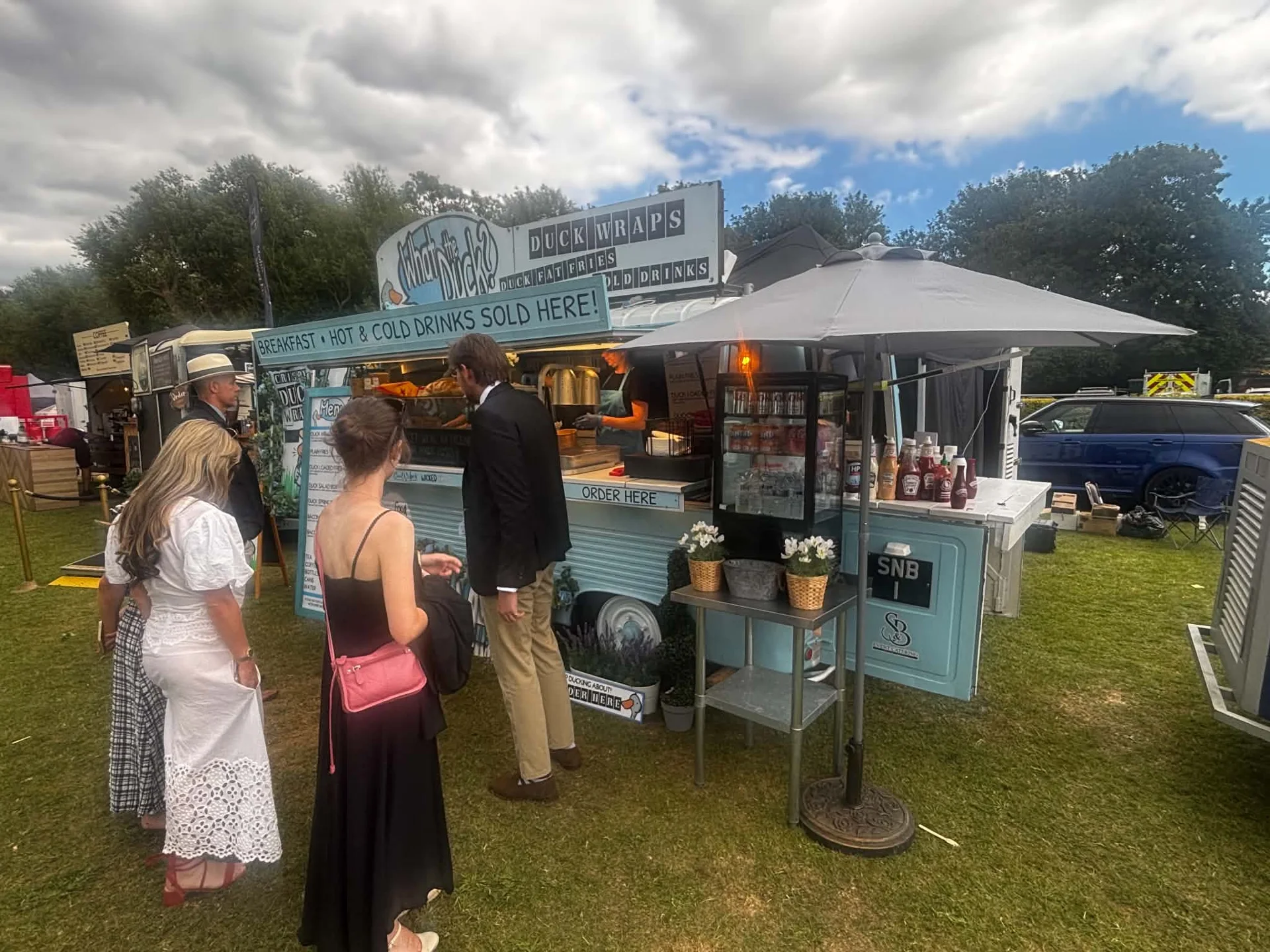 What the Duck vintage catering van serving at a real outdoor event